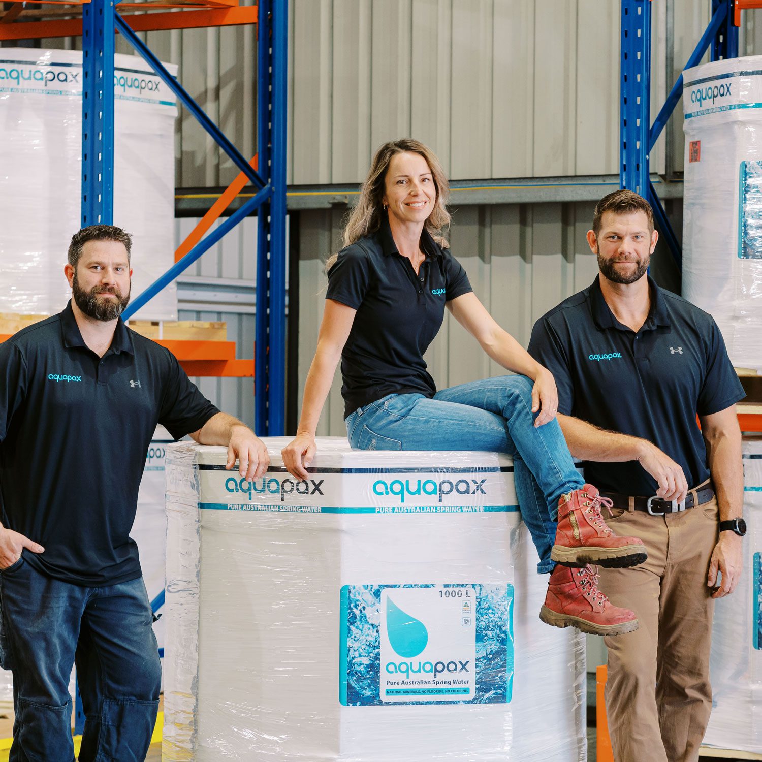 The Aquapax team smiling and sitting on a Water Pod